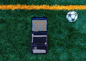 Pitch Pack soccer uniform organizer bag, open view showing zippered pockets